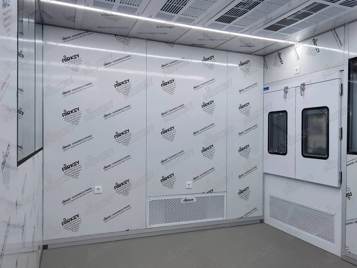 Modular cleanroom with HEPA filtered pass through