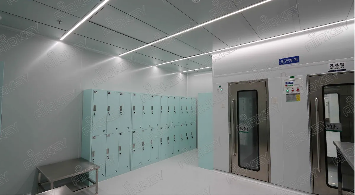 Semiconductor Modular cleanroom equipped with air shower and shoe cabinet for controlled personnel entry.